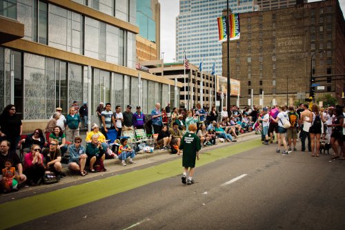 People line up outside Hennepin Central Library to watch the Twin Cities Pride parade.